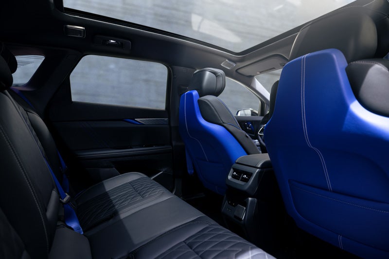 Back Seat View of the 2026 OPTIQ-V Blue Front Seats, Sun Roof, and Interior | Flow Cadillac of Wilmington in Wilmington NC