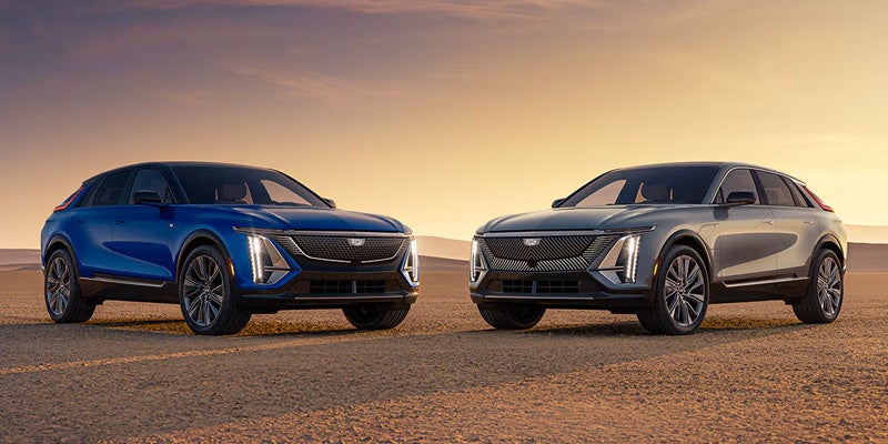 Two Cadillac LYRIQ electric SUVs parked side by side outdoors.
